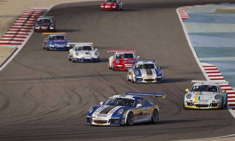 Clemens Schmid of Al Nabooda Racing leads the pack during Porsche GT3 Cup Challenge Middle East racing at the Bahrain International Circuit on March 8, 2014. Courtesy Jorge Ferrari 