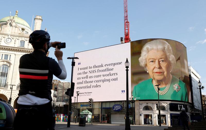 A message from Queen Elizabeth II is displayed on a screen in Piccadilly Circus, as the spread of the coronavirus disease continues, London on April 19, 2020. Reuters