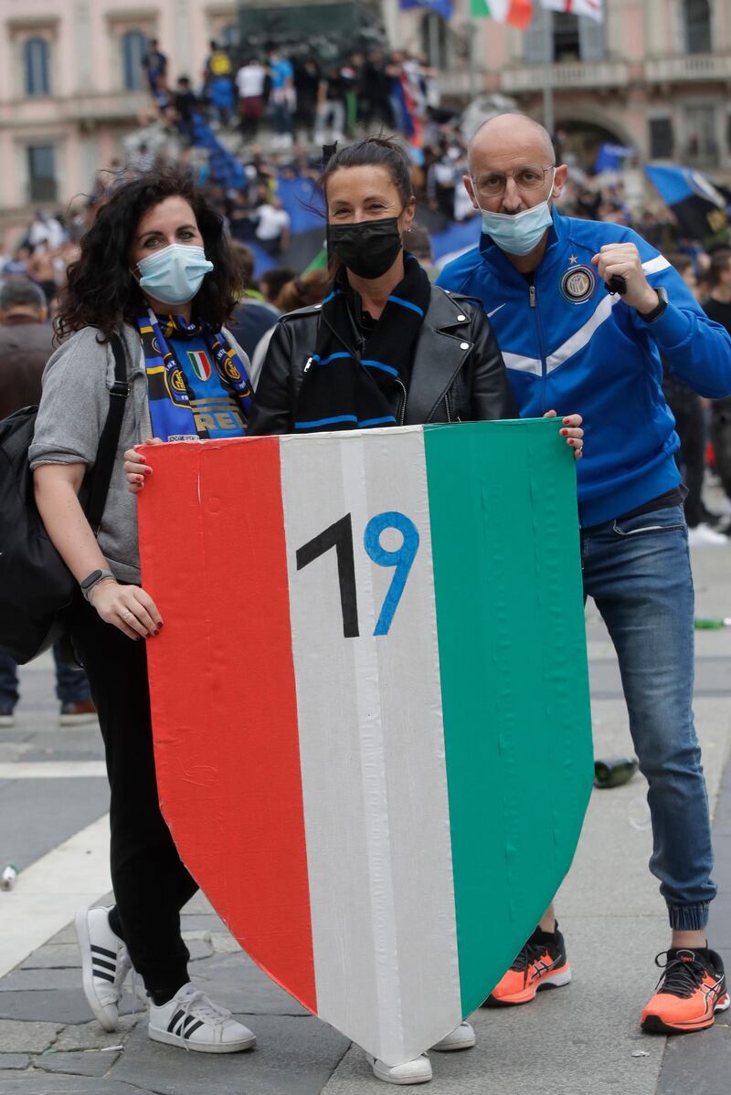 Inter Milan fans celebrate winning the Serie A title after second-placed Atalanta drew 1-1 at Sassuolo. AP