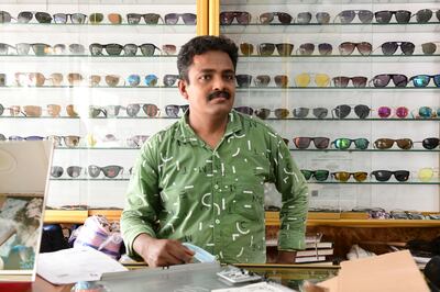 Presod Unnithean, a technician and salesman at Eye Care Centre, said flooding damaged thousands of dirhams worth of stock at the shop in Fujairah. Khushnum Bhandari / The National