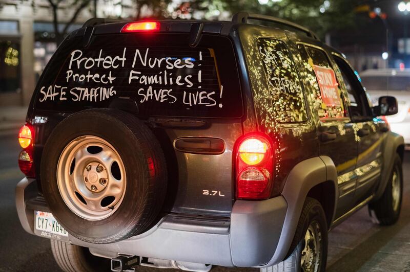 A union of registered nurses holds a car caravan honk-a-thon in downtown El Paso, Texas to show support for the stay-home order during the public health crisis due to Covid-19.  AFP