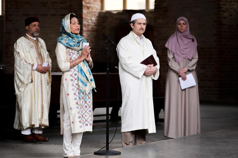 Members of the 'House of One' of various religions after a prayer in solidarity with those affected by Covid-19 at the Parochialkirche church in Berlin, Germany.  EPA