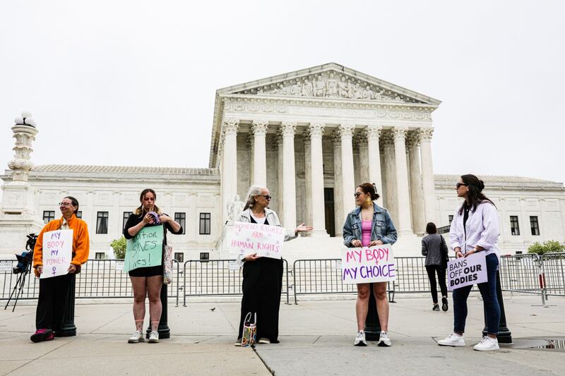 Protesters demonstrate outside the US Supreme Court in Washington. Bloomberg