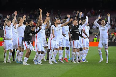 Eintracht Frankfurt's players celebrate at the end of the Europa League quarter final second leg football match between FC Barcelona and Eintracht Frankfurt at the Camp Nou stadium in Barcelona on April 14, 2022.  (Photo by Jose Jordan  /  AFP)