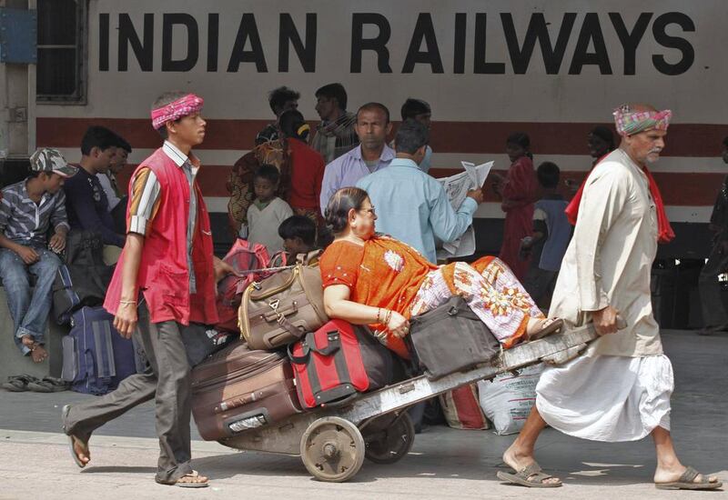 Congress vice president Rahul Gandi promised to take up with railways minister Mallikarjun Kharge porters’ porters’ demand for a complimentary pass for the entire family not once but twice in a year. Rupak De Chowdhuri / Reuters