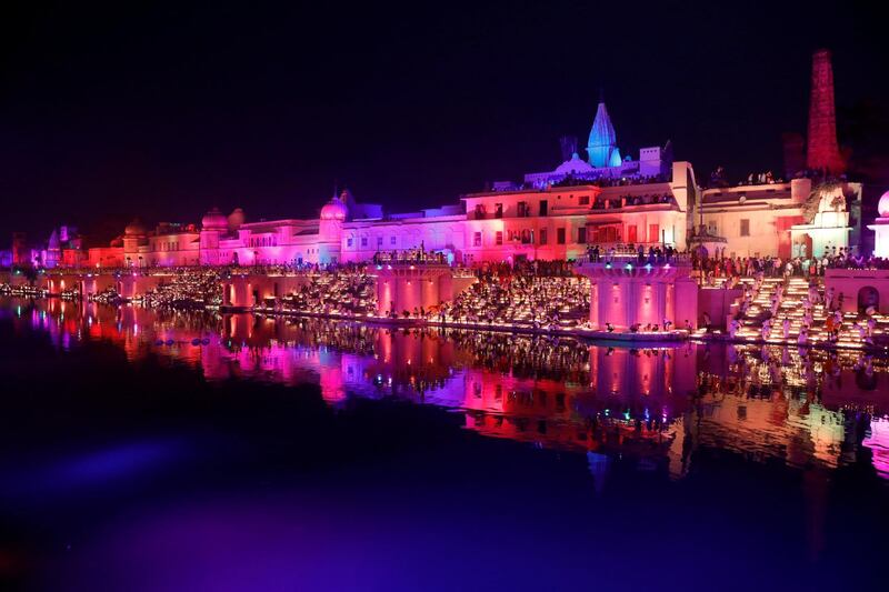 Participants light earthen oil lamps on the banks of the Sarayu river in an attempt to enter the Guinness World Records for the largest display of oil lamps on the eve of Diwali, the Hindu festival of lights, in Ayodhya, Utar Pradesh. Reuters