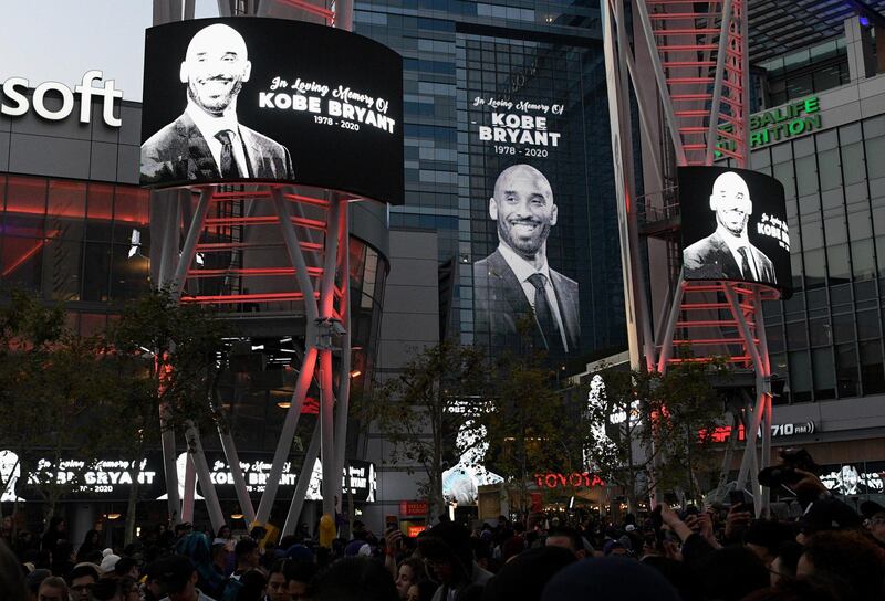 Electronic signs honor Kobe Bryant at L.A. Live in Los Angeles following reports of his death in a helicopter crash in southern California. AP Photo