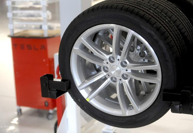 A Model S wheel awaits installation at Tesla’s factory in  California. Investors are expecting the electric carmaker to post favourable sales in China and Europe. Noah Berger / Reuters