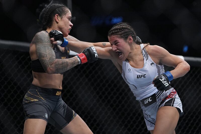 Julianna Pena moves in with a hit against Amanda Nunes. Reuters