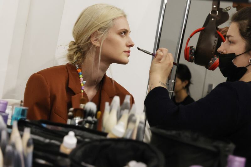 A model prepares backstage prior to the Elie Saab womenswear autumn/winter 2022-2023 show as part of Paris Fashion Week on March 5, 2022. All photos: Getty Images, unless specified otherwise