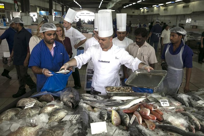 Pascal Sfara, Chef De Cuisine at Amalfi restaurant at the Le Royal Meridien hotel, picks out the freshest seafood at the fish market in Mina Zayed. Silvia Razgova / The National