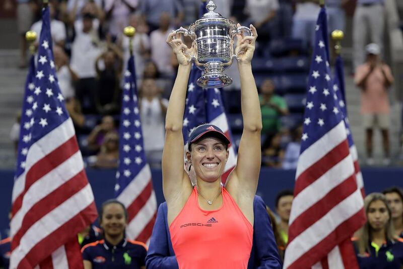 Angelique Kerber, of Germany, holds up the championship trophy after beating Karolina Pliskova. Darron Cummings / AP Photo