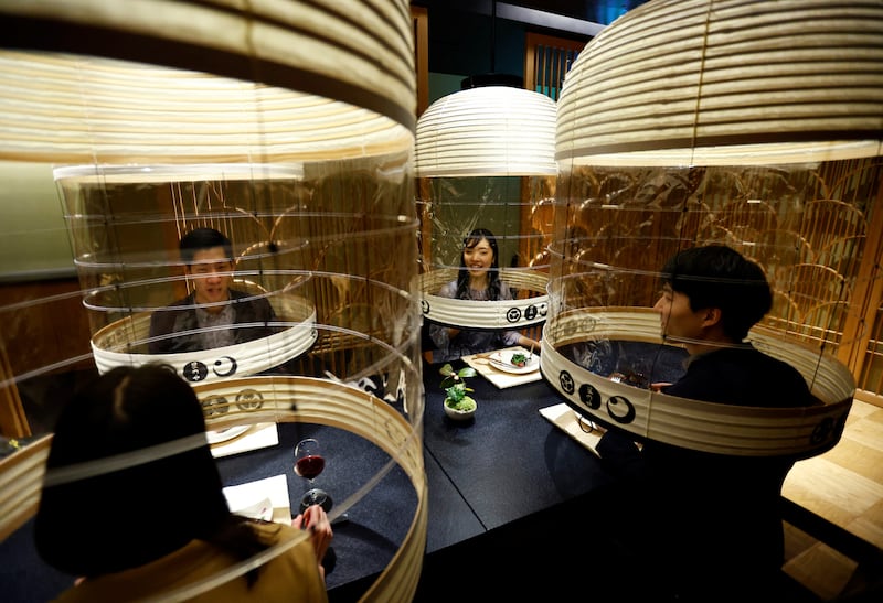 Hoshinoya Tokyo Hotel staff demonstrate a 'Lantern Dining Experience' for people who wish to dine out safely during the latest wave of the coronavirus pandemic to hit Japan's capital, Tokyo, Japan. Reuters