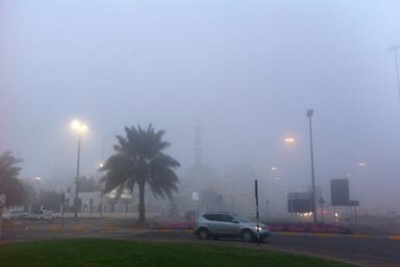 Abu Dhabi was also hit by the fog as drivers on 15th Street make their way through the mist. Scott Armstrong