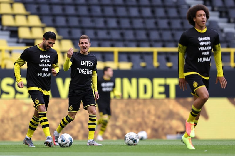 Dortmund players before the game wearing t-shirts in support of the Black Lives Matter protests in the US. AP