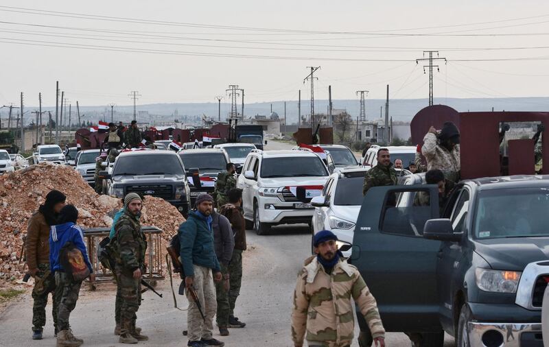 A convoy of pro-Syrian government fighters arriving in Syria's northern region of Afrin. George Ourfalian / AFP