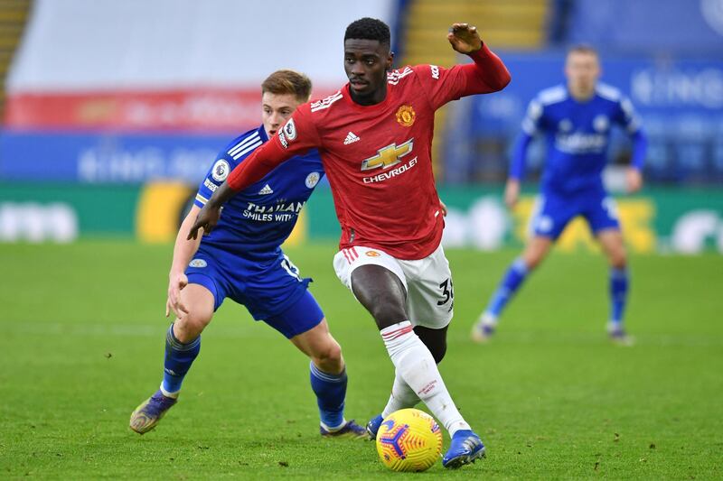 Manchester United's Congo-born English defender Axel Tuanzebe looks to play a pass during the English Premier League football match between Leicester City and Manchester United at King Power Stadium in Leicester, central England on December 26, 2020. (Photo by Glyn KIRK / POOL / AFP) / RESTRICTED TO EDITORIAL USE. No use with unauthorized audio, video, data, fixture lists, club/league logos or 'live' services. Online in-match use limited to 120 images. An additional 40 images may be used in extra time. No video emulation. Social media in-match use limited to 120 images. An additional 40 images may be used in extra time. No use in betting publications, games or single club/league/player publications. / 