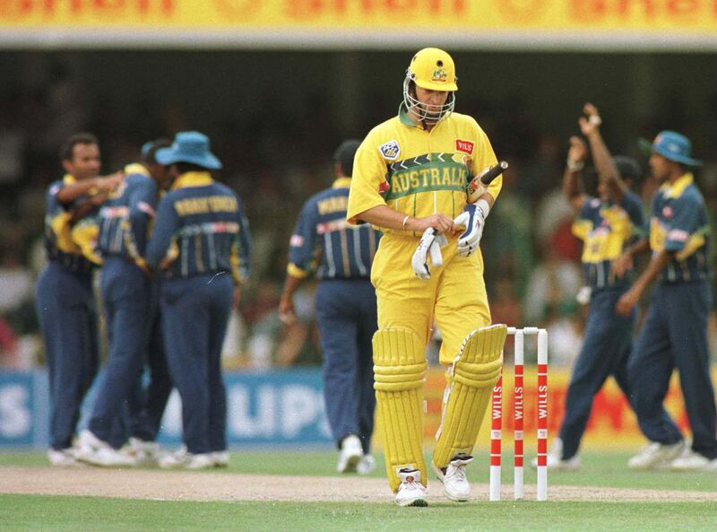 17 March 1996:  Mark Waugh of Australia walks off dejected as the Sri Lankans celebrate the early wicket during the Cricket World Cup Final between Australia and Sri Lanka played at the Gaddafi stadium in Lahore. Mandatory Credit: Shaun Botterill/ALLSPORT/Getty Images