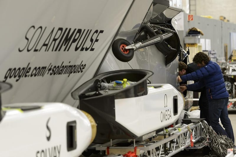 Ground crew prepare the cockpit of 'Solar Impulse 2' in Switzerland. On multi-day legs of its round-the-world journey, the pilot would take 20-minute naps while the aircraft was on autopilot.