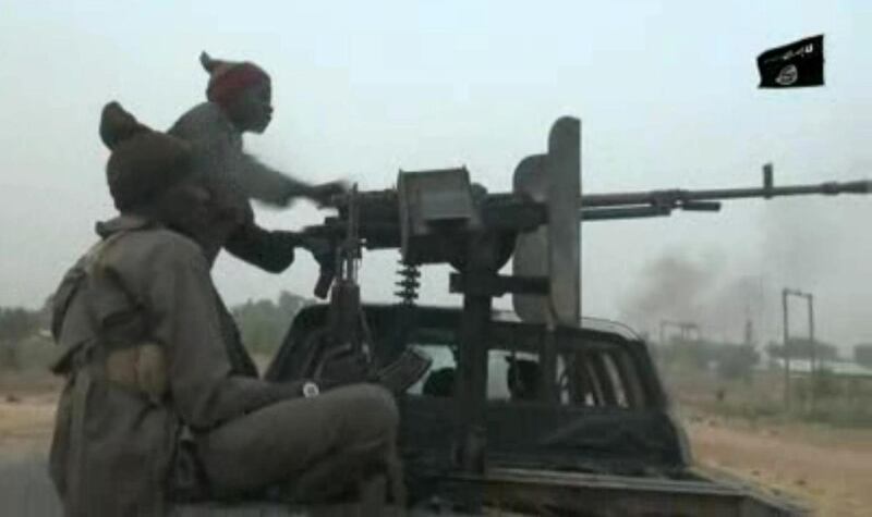 This screen grab image taken on January 2, 2018 from a video released on January 2, 2018 by Islamist group Boko Haram shows Boko Haram fighters during a Christmas Day attack on a military checkpoint in Molai village on the outskirts of the northeast Nigerian city of Maiduguri, which the military said was thwarted by troops after one hour of battle. - Boko Haram leader Abubakar Shekau released his first video message in months amid a surge in violence casting doubt on the Nigerian government's claim that the jihadist group is defeated. (Photo by Handout / BOKO HARAM / AFP) / RESTRICTED TO EDITORIAL USE - MANDATORY CREDIT "AFP PHOTO / BOKO HARAM" - NO MARKETING NO ADVERTISING CAMPAIGNS - DISTRIBUTED AS A SERVICE TO CLIENTS