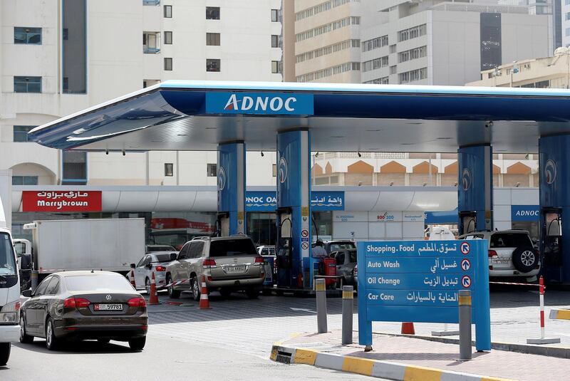 FILE PHOTO: Cars are seen an ADNOC petrol station in Abu Dhabi, United Arab Emirates July 10, 2017. REUTERS/Stringer/File Photo