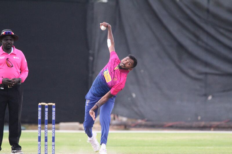 Karthik Meiyappan bowls against Jersey. He finished with figures of four for 57 off his 10 overs.