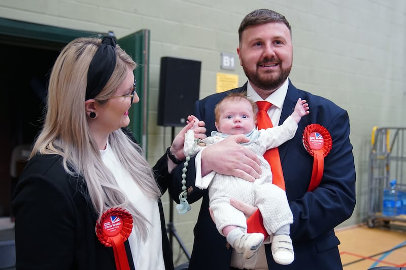 Labour candidate Chris Webb celebrates with his wife Portia and baby Cillian after winning the Blackpool South by-election. PA