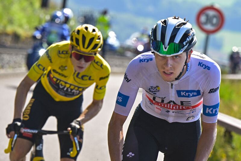 Tadej Pogacar, right, trails leader Jonas Vingegaard, left, by 17 seconds after nine stages at the Tour de France. AFP