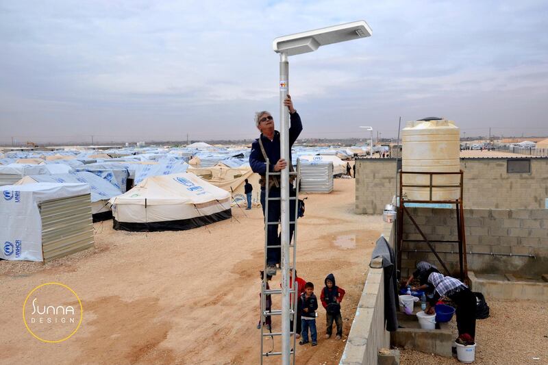 Solar street lights are set up at a refugee camp in Jordan.