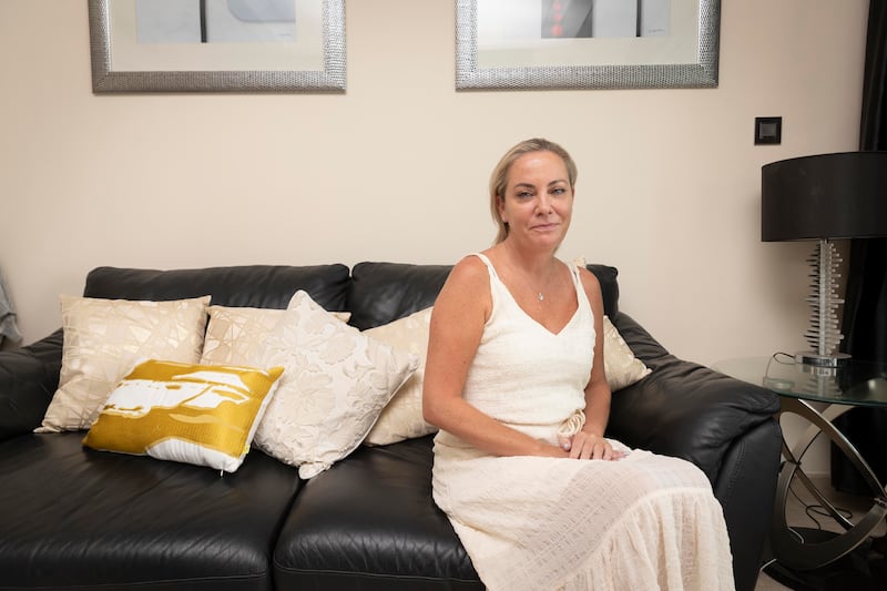 Lisa Warren pictured in her one-bedroom apartment in Dubai Marina. All photos: Antonie Robertson/The National