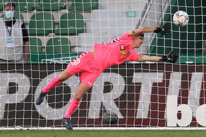 Elche's goalkeeper Edgar Badia fails to save a shot by Barcelona's Riqui Puig. AP