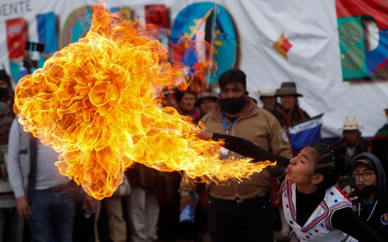 A fire-eater performs during festivities after a final official vote count released yesterday declared Luis Arce the winner of the presidential election, in El Alto, Bolivia. AP Photo