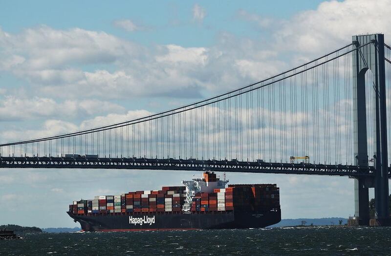A fully loaded cargo ship heads out to sea from New York Harbor. Donald Trump’s economic policies include strengthening trade barriers. Spencer Platt / AFP