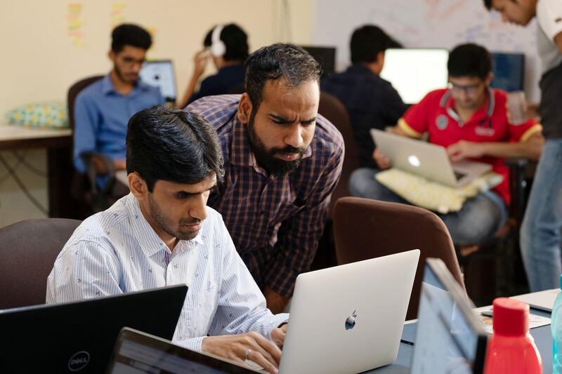 Rahul Namdev, co-founder of Betterhalf, left, works at the company's office in Bangaluru, India, on Monday, Jan. 21, 2019. Engineer Namdev teamed up with Pawan Gupta to create Betterhalf, an AI-powered matchmaking app that would determine emotional, intellectual and social compatibility, employing a wide swath of data to figure out who could be successfully matched for marriage. Photographer: Karen Dias/Bloomberg