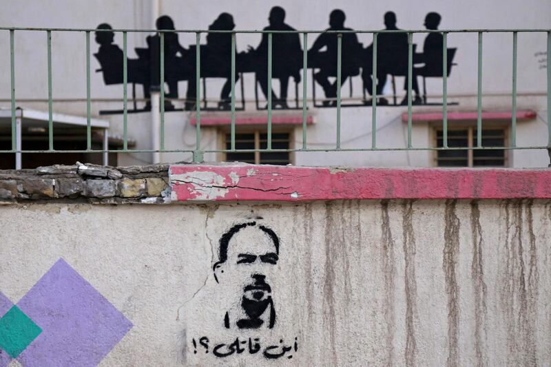 Graffiti reading in Arabic "Where's my killer?" and depicting Iraqi anti-government activist Ihab Al Wazni is seen in the shrine city of Karbala, Iraq. AFP