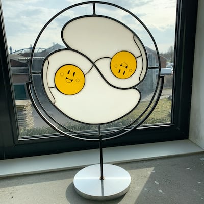 A piece from Arjan Boeve's 'Sunny Side Up' series depicting egg yolks as emojis. Courtesy Arjan Boeve