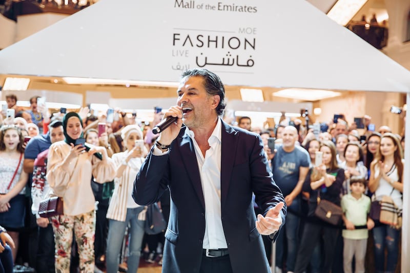 Ragheb Alama sings as part of the MOE Fashion Live runway shows. Mall of the Emirates