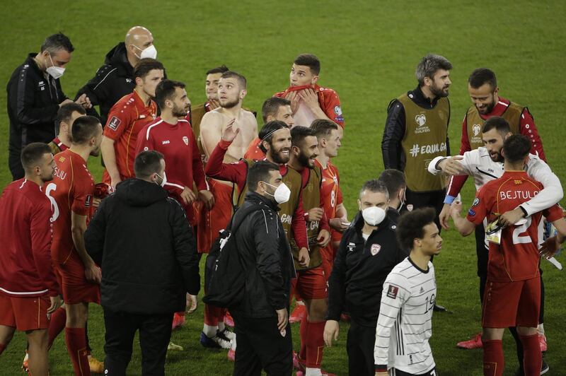 North Macedonia players celebrate after the game, EPA