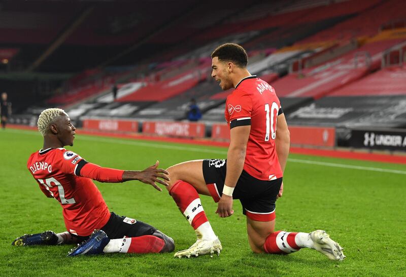 SOUTHAMPTON, ENGLAND - NOVEMBER 06: Southampton player  Che Adams celebrates his opening goal with Moussa Djenepo (l) during the Premier League match between Southampton and Newcastle United at St Mary's Stadium on November 06, 2020 in Southampton, England. Sporting stadiums around the UK remain under strict restrictions due to the Coronavirus Pandemic as Government social distancing laws prohibit fans inside venues resulting in games being played behind closed doors. (Photo by Stu Forster/Getty Images)