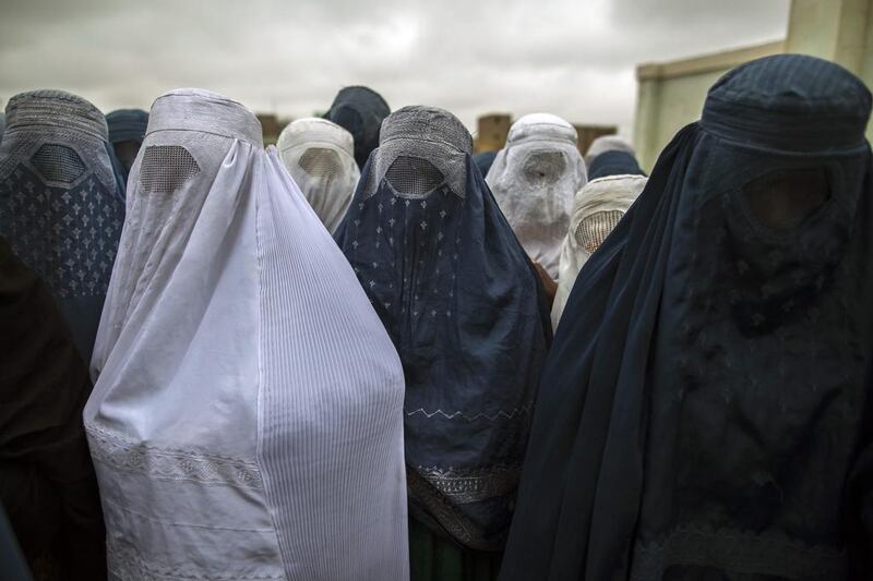 Afghan women wait to cast their ballot at a polling station in Mazar-i-sharif April 5, 2014. Voting began on Saturday in Afghanistan’s presidential election, which will mark the first democratic transfer of power since the country was tipped into chaos by the fall of the hardline Islamist Taliban regime in 2001. Zohra Bensemra / Reuters