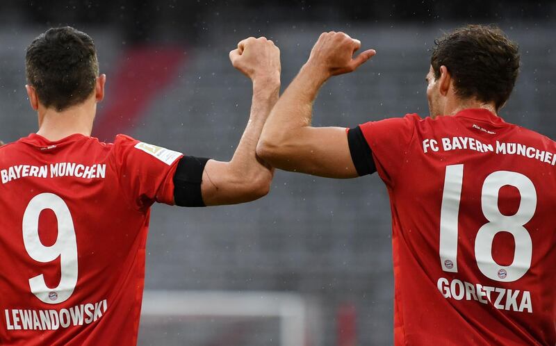 Bayern Munich's Leon Goretzka celebrates scoring the opening goal with Robert Lewandowski on Saturday. AFP