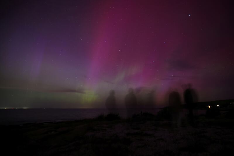 Admirers watch the aurora borealis over Gloucester, Massachusetts. Reuters
