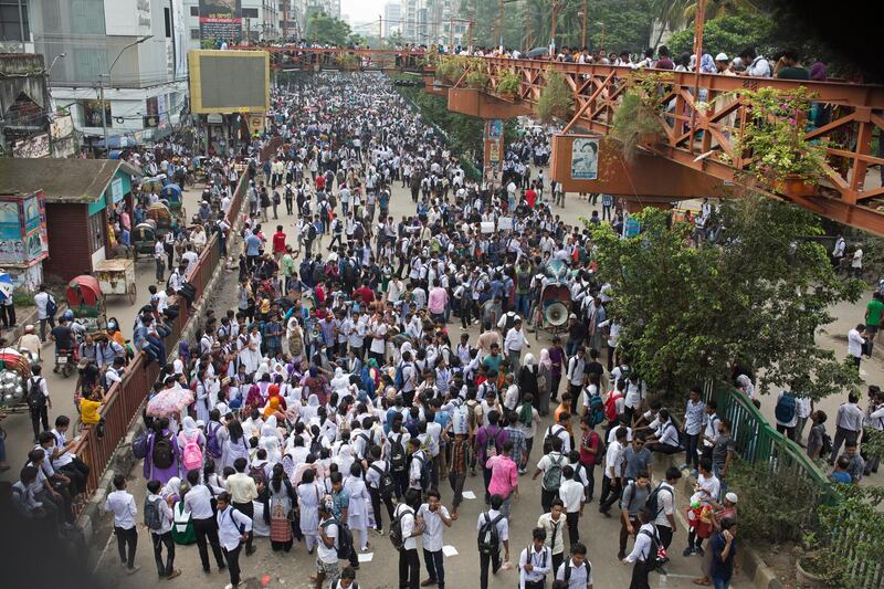 Hundreds of Bangladeshi students shout slogan and block roads during a rally demanding safe roads on the seventh consecutive day of protests, in Dhaka city, Bangladesh.  EPA / MONIRUL ALAM