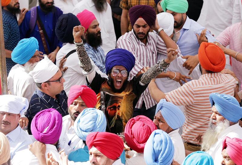 A Sikh man shouts pro-Khalistan slogans after a scuffle broke out between radical Sikhs and security officers, after a memorial for hundreds of people who were killed during Operation Blue Star in 1984, at the Akaal Takhat, the highest temporal seat for the Sikhs, within the Golden Temple premises, in Amritsar, India. EPA