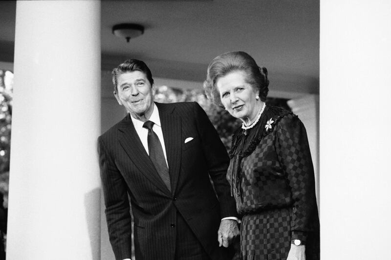 FILE - In this June 23, 1982 file photo, President Ronald Reagan and British Prime Minister Margaret Thatcher speak to reporters at the White House in Washington.  Ex-spokesman Tim Bell says that Thatcher has died. She was 87. Bell said the woman known to friends and foes as "the Iron Lady" passed away Monday morning, April 8, 2013. (AP Photo/File) *** Local Caption ***  Britain Obit Thatcher.JPEG-0d470.jpg