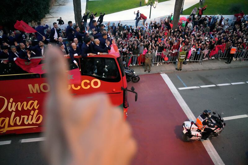 The Morocco players are welcomed home by fans in Rabat. AP 