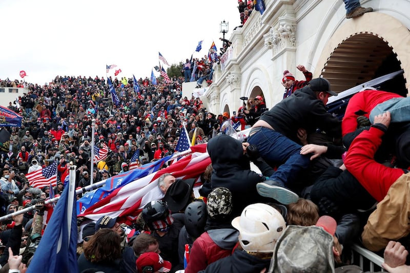 Pro-Trump protesters storm into the U.S. Capitol during clashes with police, during a rally to contest the certification of the 2020 U.S. presidential election results by the U.S. Congress, in Washington, U.S, January 6, 2021. Reuters