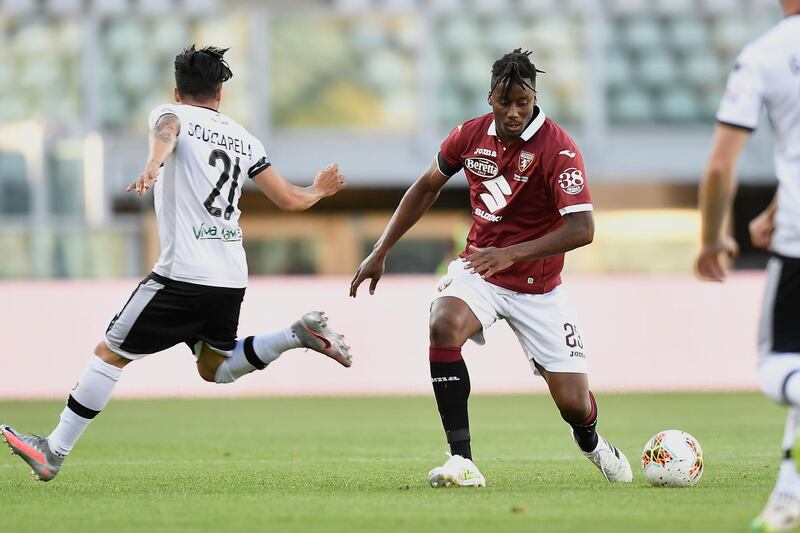 Torino's Soualiho Meite goes for the ball ahead of Parma's Matteo Scozzarella. AP Photo