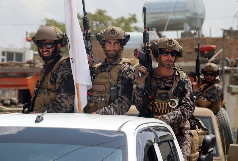 Taliban special force fighters arrive inside the Hamid Karzai International Airport. AP