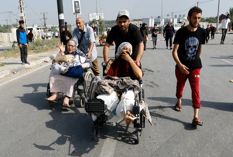 A wounded Palestinian woman is moved from Al Shifa Hospital to the south of the Gaza Strip as Israeli tanks roll deeper into the enclave. Reuters